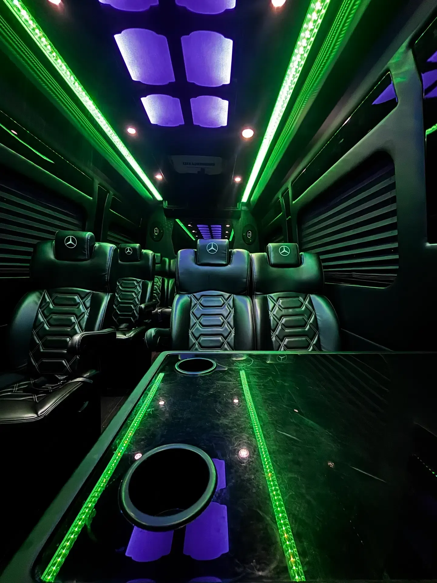 Premium executive sprinter interior with leather seating and ambient lighting